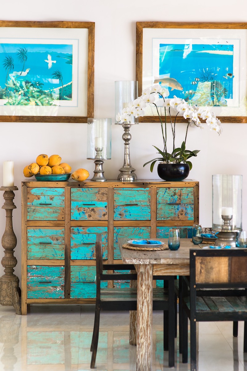 An eclectic room decorated with estate sale finds, antiques, and vintage furniture and decorative elements